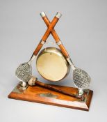 A silver plated lawn tennis-themed dinner gong circa 1880,
by B & O'N,
