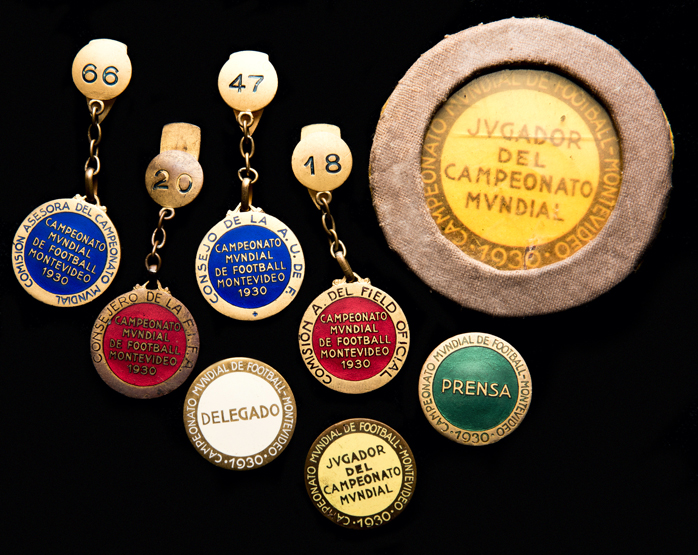 A fine collection of eight official 1930 World Cup badges,