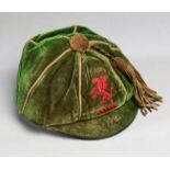 A green Wales international cap awarded to Moses Russell in 1921,