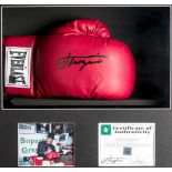 A Joe Frazier signed boxing glove,
a red Everlast right-hand glove signed in black marker pen,