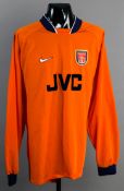 David Seaman: an orange Arsenal goalkeeping jersey circa 1997,
long-sleeved, no sleeve badging,