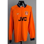 David Seaman: an orange Arsenal goalkeeping jersey circa 1997,
long-sleeved, no sleeve badging,