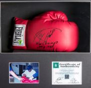 A Larry Holmes signed boxing glove,