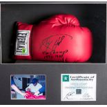 A Larry Holmes signed boxing glove,