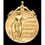 A 9ct. gold London Football Association Professional Charity Fund medal awarded to A.B.