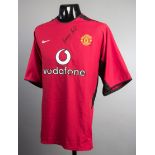 A George Best signed Manchester United jersey,