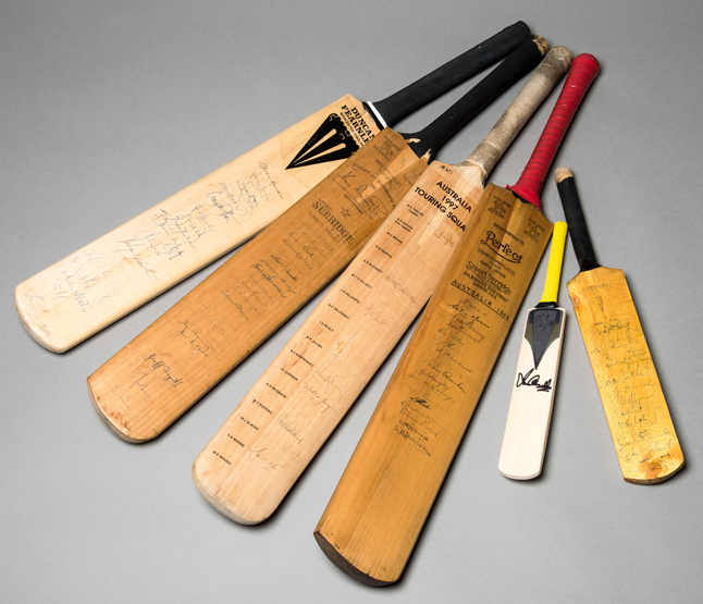 Six autographed cricket bats signed by Australians,