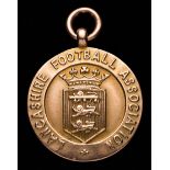 A 9ct. gold Lancashire Football Association Junior Cup winner's medal awarded to P.H.