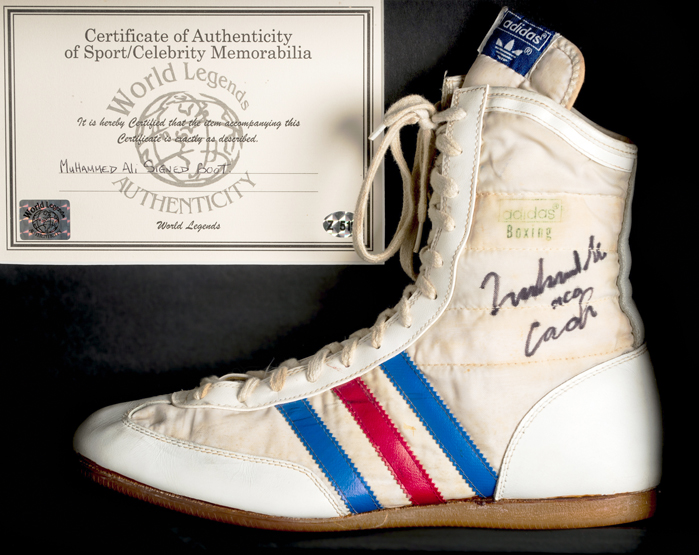 A Muhammad Ali signed Adidas boxing boot,