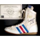 A Muhammad Ali signed Adidas boxing boot,
