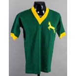 A green South Africa XI football jersey 1958,
short-sleeved with gold cuffs,