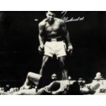 A Muhammad Ali signed photograph,
b&w 7 1/4 by 9 1/4 image of Ali standing over Sonny Liston,