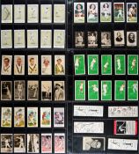 A card album containing a mixed collection of over 450 old and unusual cigarette and biscuit cards