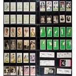 A card album containing a mixed collection of over 450 old and unusual cigarette and biscuit cards