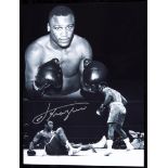 A signed b&w Joe Frazier photo print,
16 by 12in.