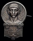 A Stockholm 1912 Olympic Games participation lapel badge,
silvered metal by Sporrong & Co.