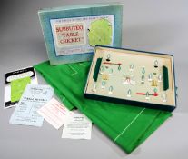 A 1950s boxed set of Subbuteo Table Cricket,
playing pitch, a pair of wickets,