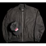Murray Walker's Penske black silk jacket by Hugo Boss and Team Penske cap,