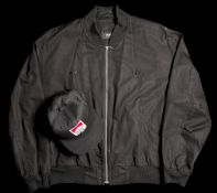 Murray Walker's Penske black silk jacket by Hugo Boss and Team Penske cap,