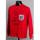 A TOFFS red England 1966 World Cup final retro jersey signed by 10 of the World Cup winners,