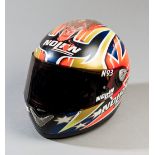 2003 Casey Stoner 125cc GP race worn and crashed helmet,