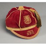 A red Wales international cap awarded to Gary Sprake of Leeds United in season 1964-65,