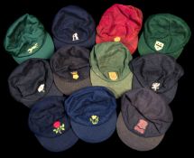 A collection of 11 County Cricket caps,