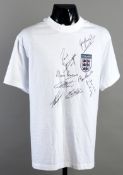 A white t-style football shirt signed by