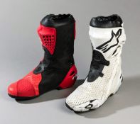 2012 Jorge Lorenzo MotoGP race boots by Alpinestars,
the right one in orange with white logo,