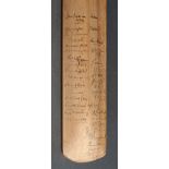 A child's-size cricket bat autographed b