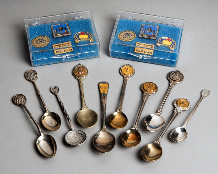 10 silver-plated tennis spoons,
together with 2 low numbered 1998 U.S.