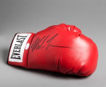 A Mike Tyson signed boxing glove,
right-hand red Everlast,