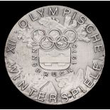 An Innsbruck 1976 Winter Olympic Games participant's medal,
silvered bronze, 50mm, by W.