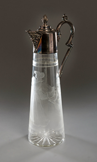 An unusual Victorian glass wine decanter engraved to the body with a lawn tennis scene,