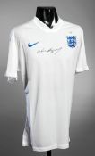 A Wayne Rooney signed white England replica jersey,