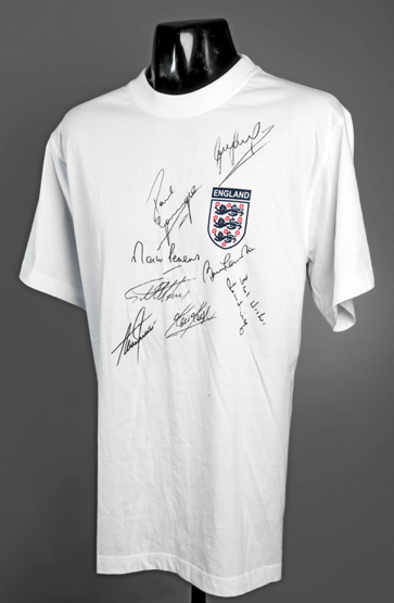 An England legends signed shirt,
Paul Gascoigne, Martin Peters, Bobby Charlton, Geoff Hurst,