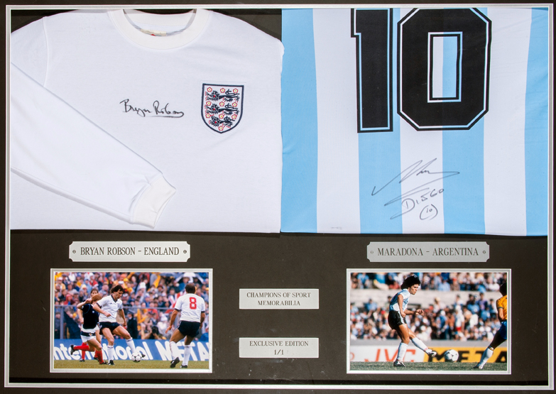 A framed presentation of autographed shirts from Diego Maradona and Bryan Robson the Argentina and