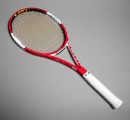 A Roger Federer match-used tennis racquet 2006,
a red & white Wilson six-one tour 90 ncode,