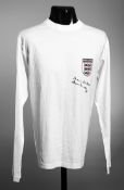 A white England supporter's shirt signed by Sir Tom Finney,