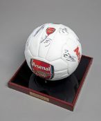 A souvenir Arsenal football signed by the 2012-13 squad,
14 signatures in black maker pen,
