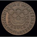 An Innsbruck 1964 Winter Olympic Games participant's medal,
bronze, 61mm, by Welz,