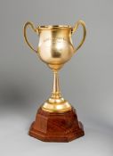 The 1931 Caulfield Cup,
an 18ct. gold two-handled trophy cup by T. Gaunt & Co.