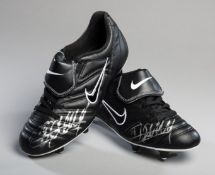 A pair of football boots signed by Thierry Henry,
black Nike Tempo 650 boots,