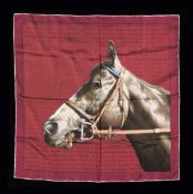 A silk scarf designed with a head of a thoroughbred,