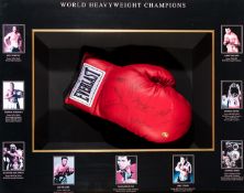 A World Heavyweight Champions multi-signed boxing glove framed presentation,