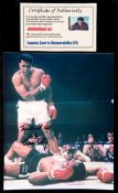 A Muhammad Ali signed photograph,
colour 9 1/2 by 8in.