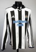 A Newcastle United replica home jersey signed by Bobby Robson and Alan Shearer,