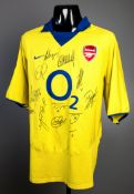 A yellow replica Arsenal shirt signed by 2003-04 'Invincibles' team,
Wenger, Henry, Vieira, Pires,