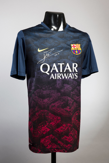 A signed Lionel Messi Barcelona training top,
signature in silver marker pen,