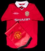A replica Manchester United 1999 Champions League Final shirt signed by Alex Ferguson,